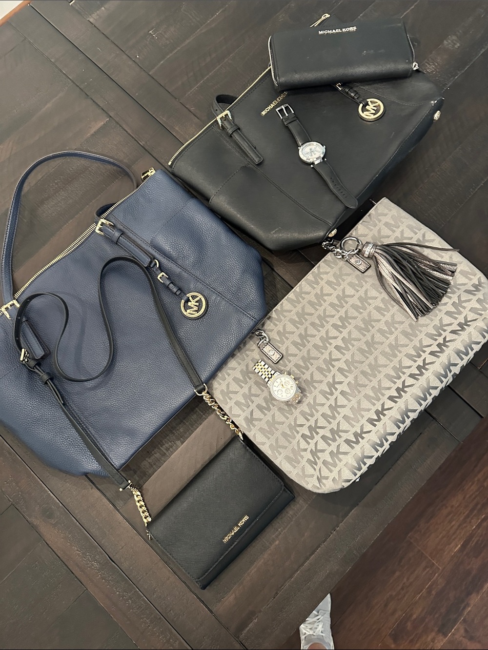 BUNDLE- Michael Kors purses
1 black wallet
2 watches